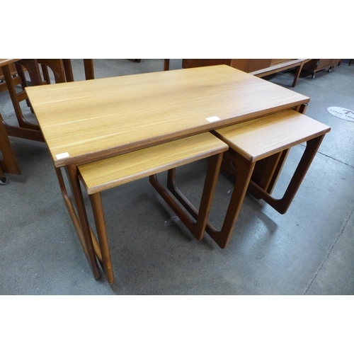 91 - A teak drop-leaf nest of tables