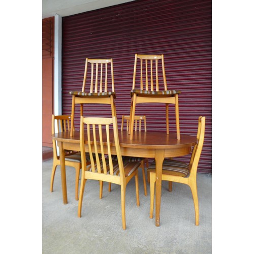 145c - A teak extending dining table and six chairs