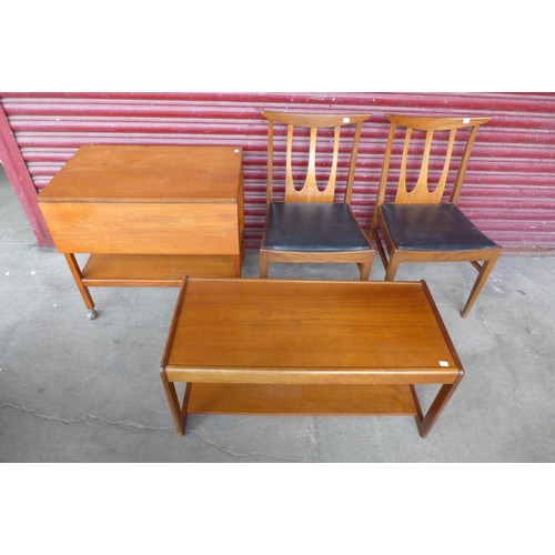 145d - A teak coffee table, trolley and pair of chairs