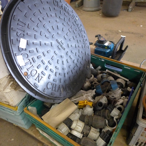 2416 - Crate of water pipe fittings and a plastic manhole top