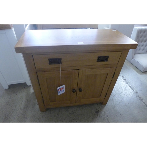 1863 - A oak two door sideboard - damaged  *This lot is subject to VAT