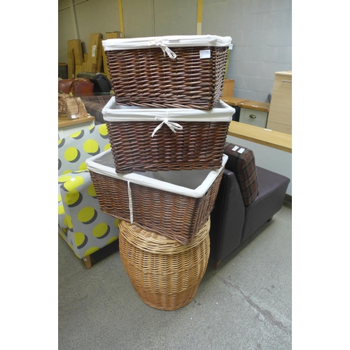 1875 - A set of three baskets and a laundry basket