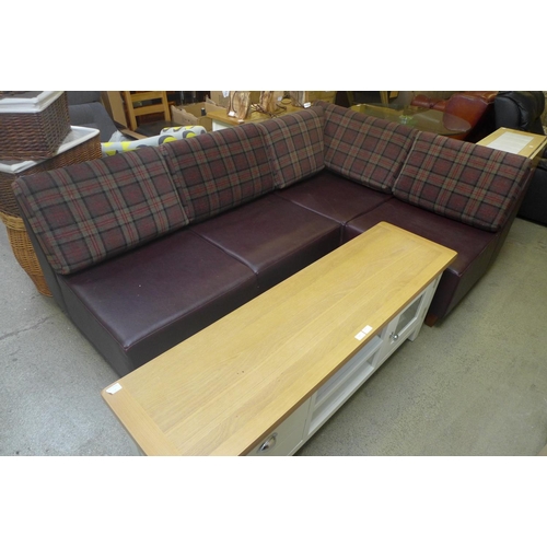 1876 - A brown leather corner seating unit with tweed cushions