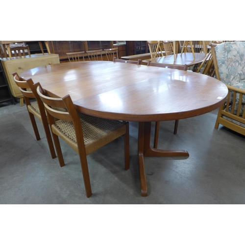 136 - A Danish teak extending dining table and four chairs