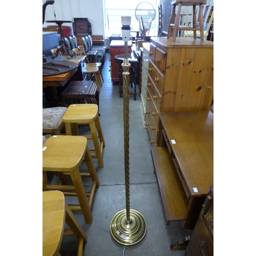 211 - A brass barleytwist standard lamp