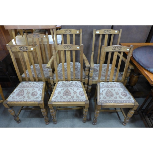 213 - A set of six oak dining chairs