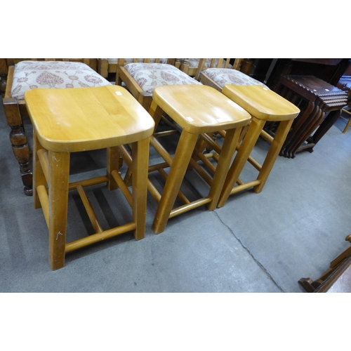 214 - A set of three beech stools