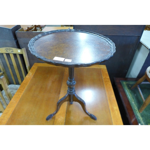 217 - A burr walnut tripod wine table