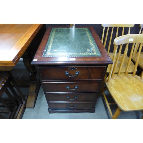 218 - A mahogany and leather topped filing cabinet