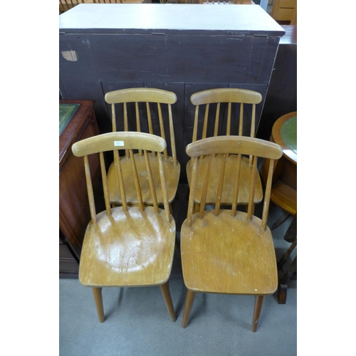 219 - A set of four Ercol style beech kitchen chairs