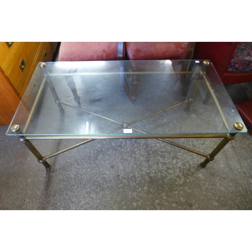 223 - A brass and glass topped x-frame coffee table