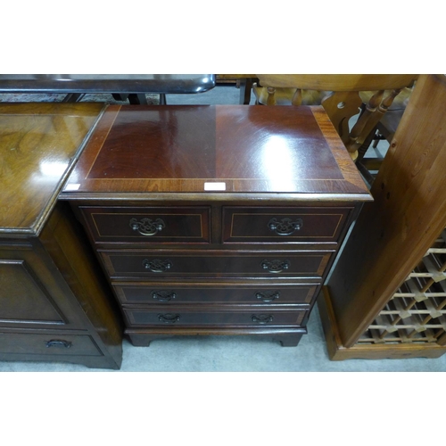 228 - A small inlaid mahogany chest of drawers