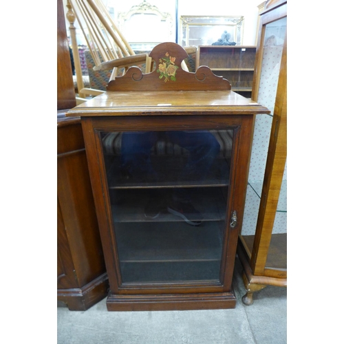 242 - A Victorian walnut music cabinet