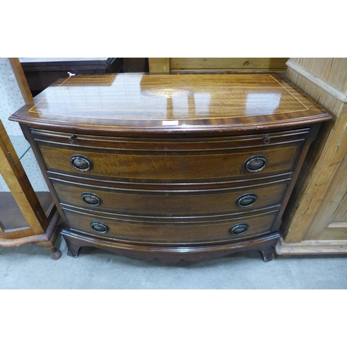 244 - A Regency style inlaid mahogany bow front chest of drawers