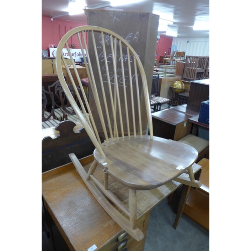 263 - An Ercol Blonde low rocking chair, a/f