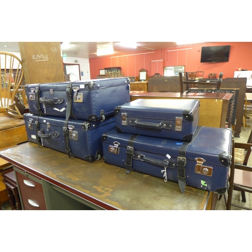 268 - A set of four Globetrotters suitcases