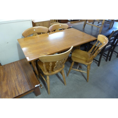 280 - An oak refectory table and four chairs