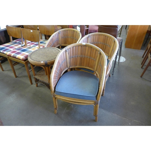 283 - A set of three bamboo armchairs and a table