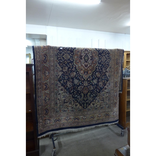 300 - A Turkish blue ground rug