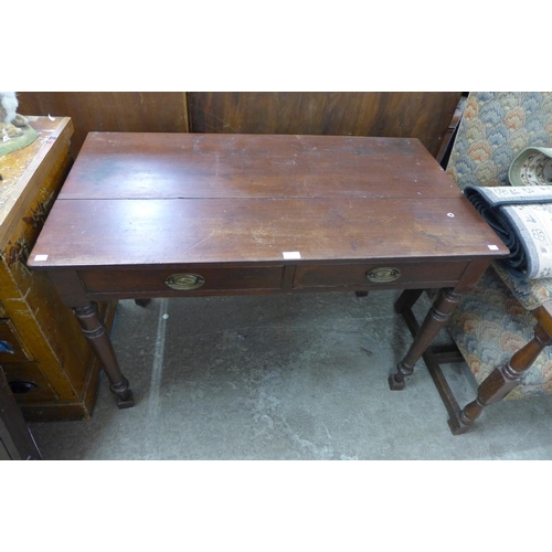 311 - A Victorian mahogany two drawer serving table