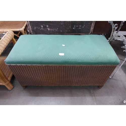 323 - A Lloyd Loom wicker ottoman