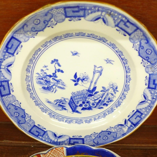 689 - Three Imari plates, other plates and an Ironstone bowl