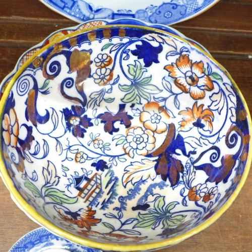 689 - Three Imari plates, other plates and an Ironstone bowl