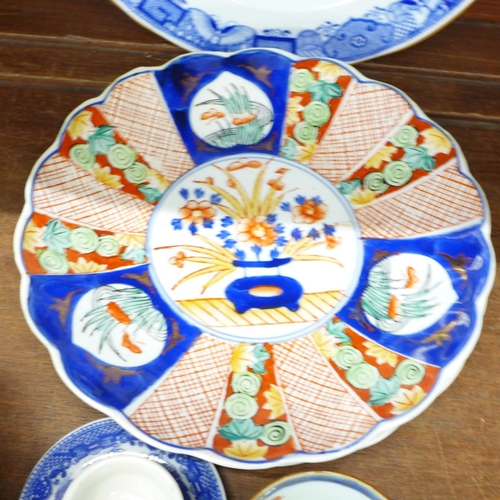 689 - Three Imari plates, other plates and an Ironstone bowl