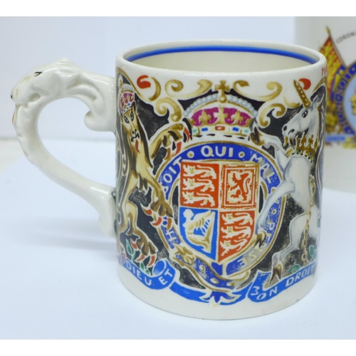 706 - A King Edward VIII coronation mug, designed by Laura Knight, other commemorative mugs, a blue marble... 