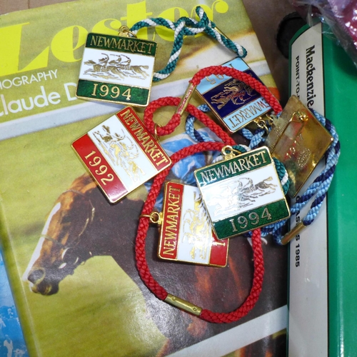 740 - A horse racing winner's blanket with rosettes, Newmarket enamel badges, a Benson and Hedges Book of ... 