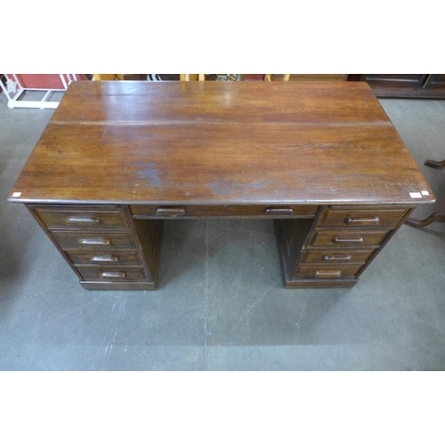 82 - An early 20th Century oak pedestal desk