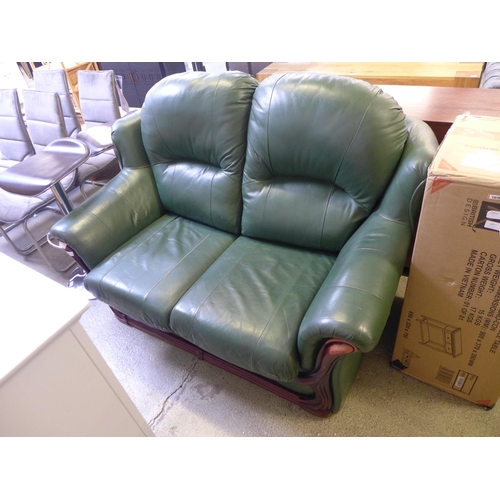 1997 - A green leather Laura Ashley two seater sofa