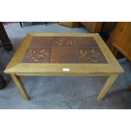 108 - A Danish Gunnar N. Larsen Mobelfabrik light oak and tiled top coffee table and a teak and tiled top ... 