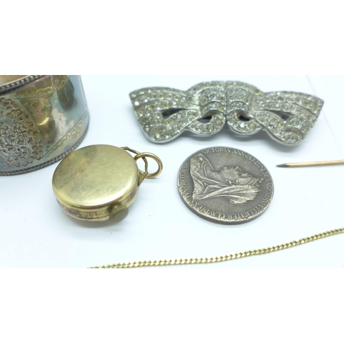 1035 - A plated napkin ring, rolled gold wristwatch head, stick pin, brooch/clip, necklet and medallion