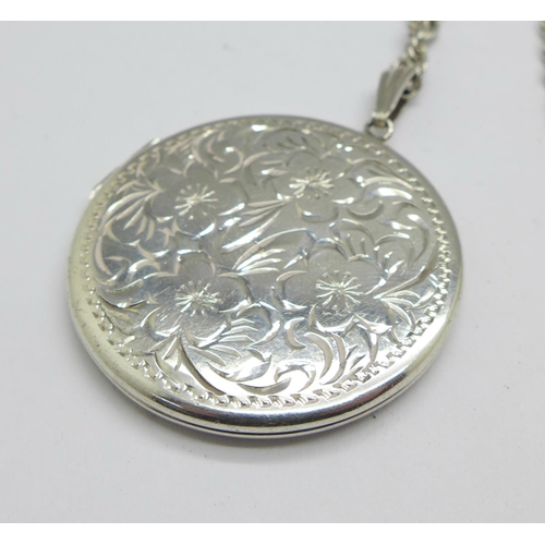 1037 - A silver locket and chain, 18g