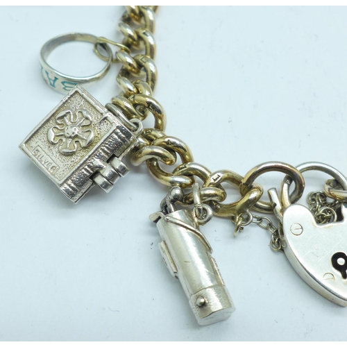 1059 - A silver charm bracelet, 51g