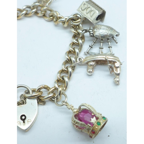 1059 - A silver charm bracelet, 51g