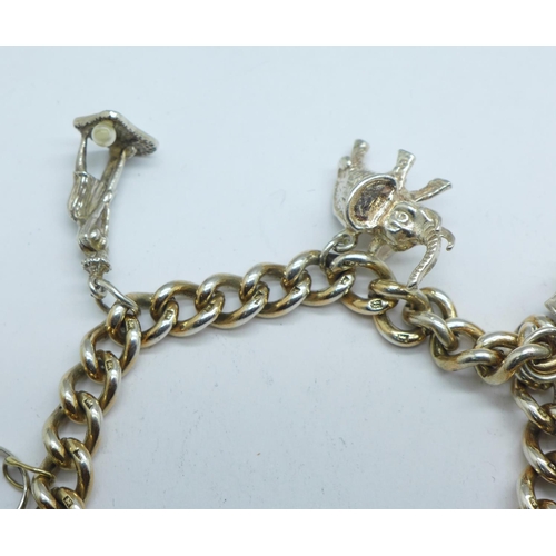 1059 - A silver charm bracelet, 51g