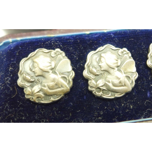 1064 - A set of six silver Art Nouveau buttons, cased