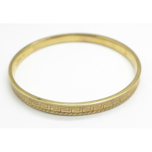 1073 - A 9ct gold bangle, 10.8g