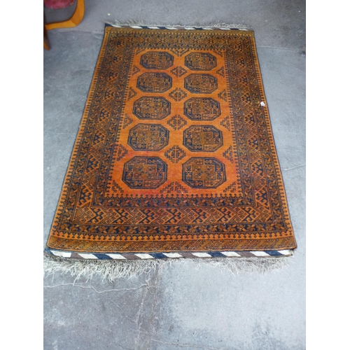 74 - A mustard ground rug, 196 x 130cms