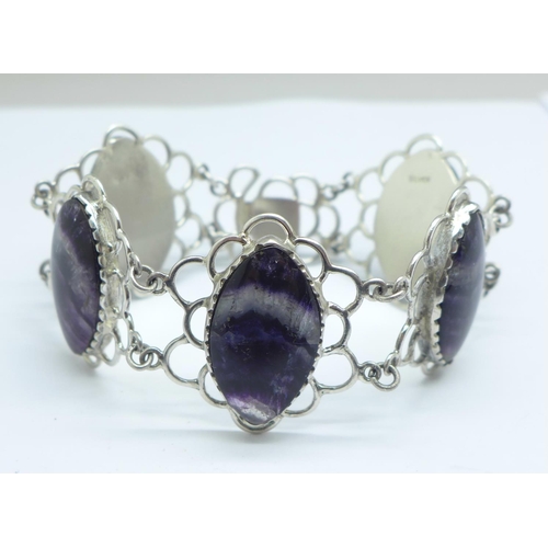 1081 - A silver bracelet set with Blue John in large matched marquise cut cabochons measuring 2.5cm x 1.7cm