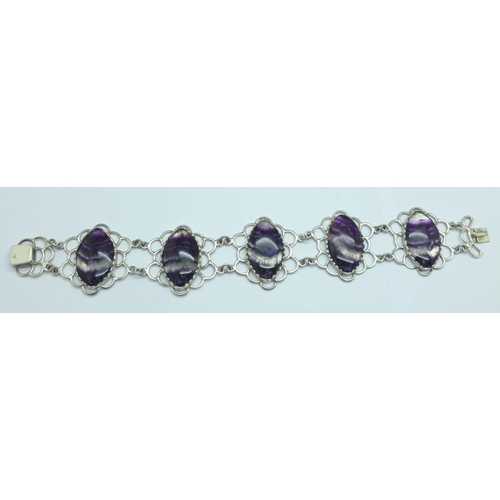 1081 - A silver bracelet set with Blue John in large matched marquise cut cabochons measuring 2.5cm x 1.7cm