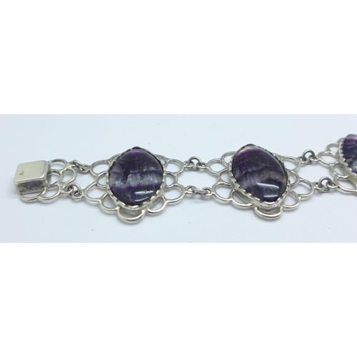 1081 - A silver bracelet set with Blue John in large matched marquise cut cabochons measuring 2.5cm x 1.7cm