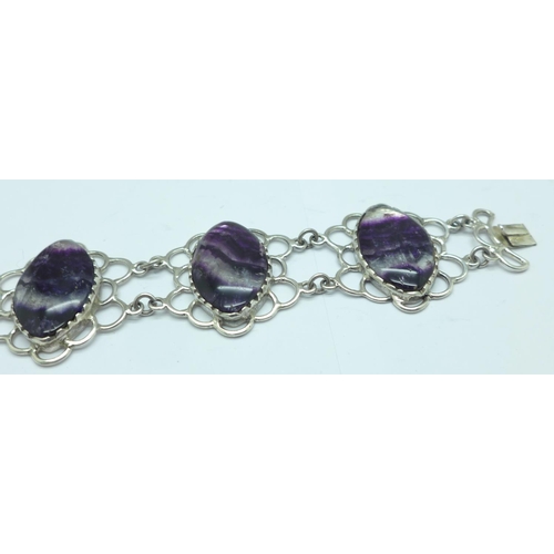 1081 - A silver bracelet set with Blue John in large matched marquise cut cabochons measuring 2.5cm x 1.7cm