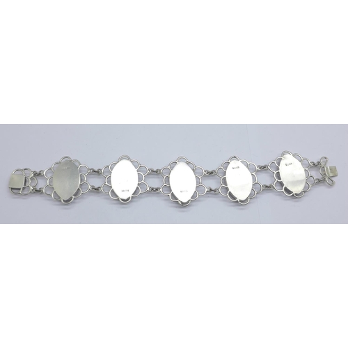 1081 - A silver bracelet set with Blue John in large matched marquise cut cabochons measuring 2.5cm x 1.7cm