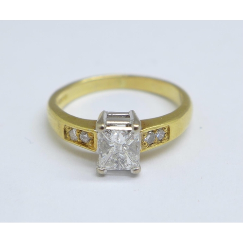 1082 - An 18ct gold ring set with 0.6 carat Princess cut solitaire and diamond set shoulders, 3.3g, J