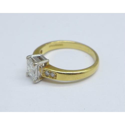 1082 - An 18ct gold ring set with 0.6 carat Princess cut solitaire and diamond set shoulders, 3.3g, J