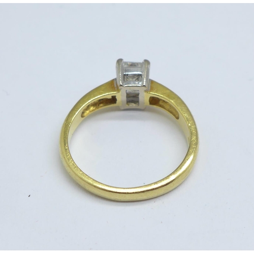 1082 - An 18ct gold ring set with 0.6 carat Princess cut solitaire and diamond set shoulders, 3.3g, J