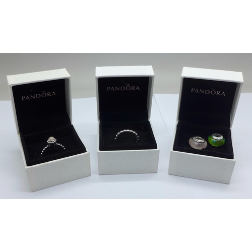 1085 - Two Pandora rings, L, N and two Pandora glass charms